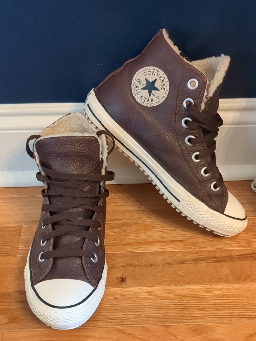 Converse brown leather Converse Chuck Taylor All Star high top sneakers featurin